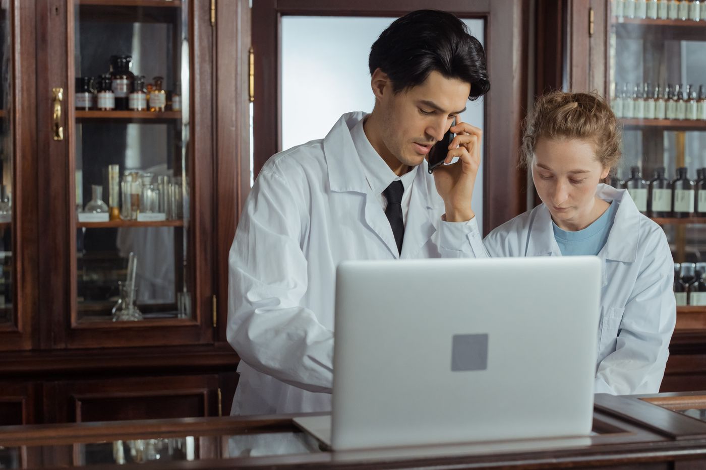 A pharmacist helping a patient over the phone