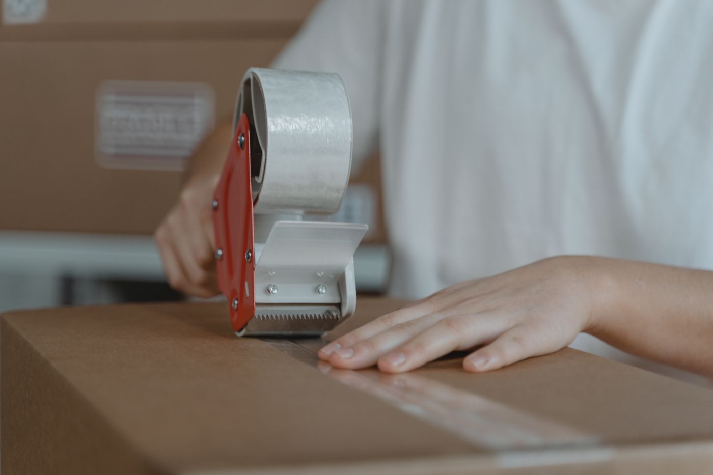 A parcel being sealed with tape