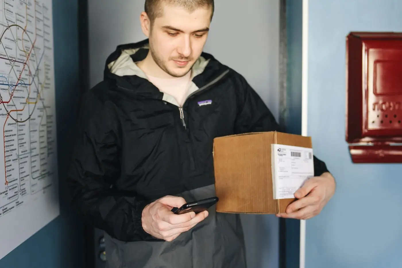 A man opening his medicine parcel at home